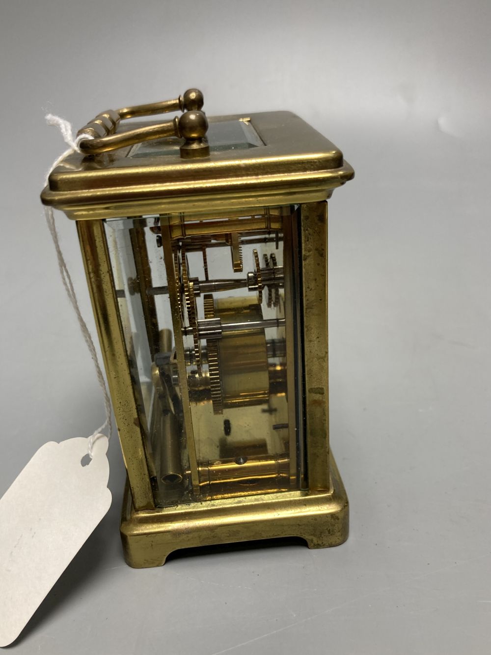 A gilt-brass carriage timepiece, with white enamelled Roman dial and outer travelling case and another carriage clock (2)